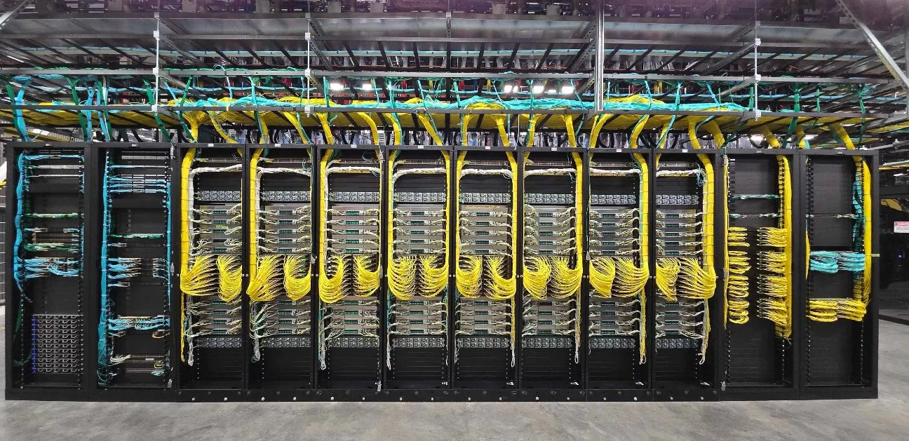 An image showing eight racks connected together in one massive NVLink domain.