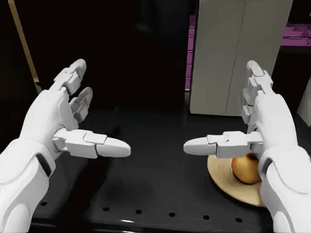 Gif shows two robot arms picking and placing an apple onto a plate in simulation. 
